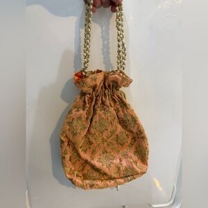 Peach and gold potli evening bag Indian